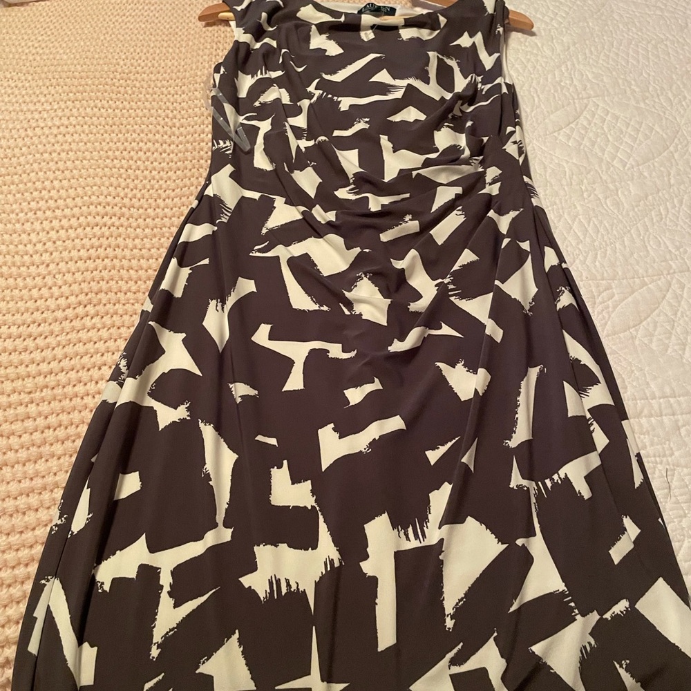 fitted knee length. Never worn but the tag fell off. Some ruching on the waist